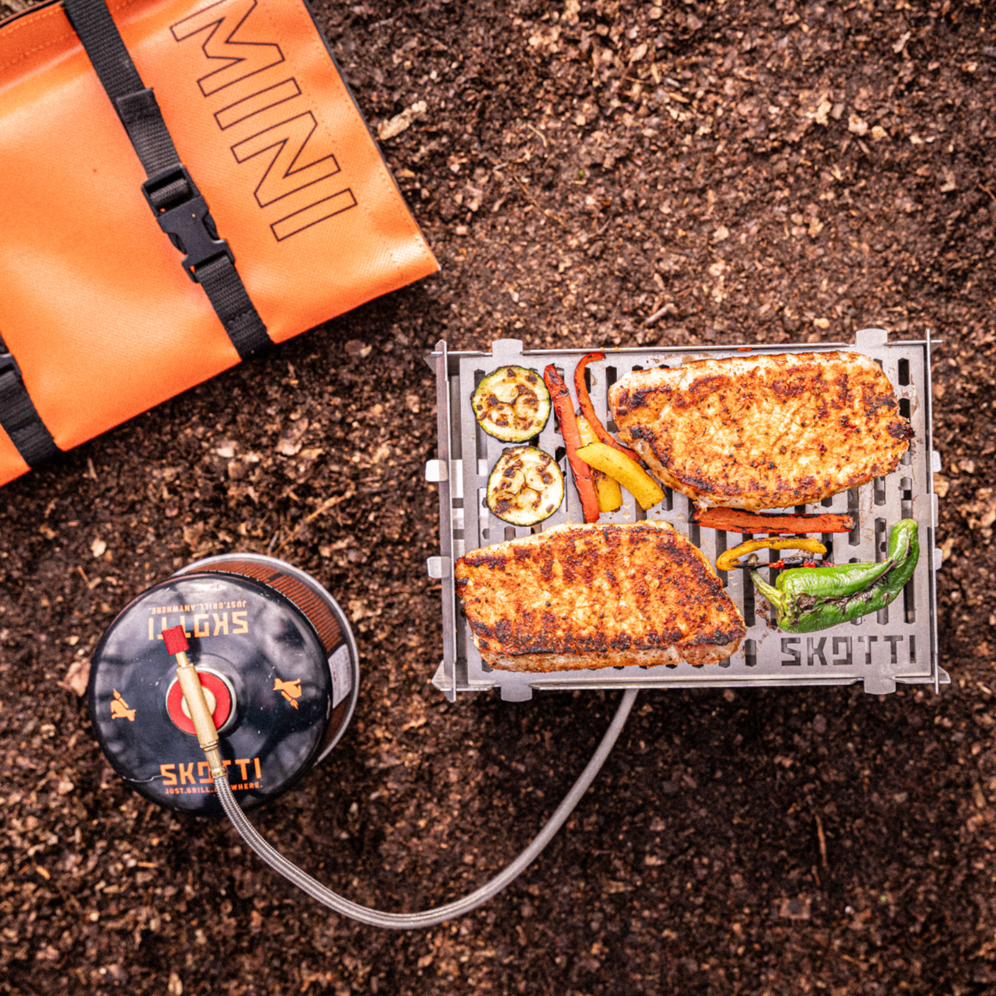 SKOTTI Mini mit Booster, Grillgut und Tasche